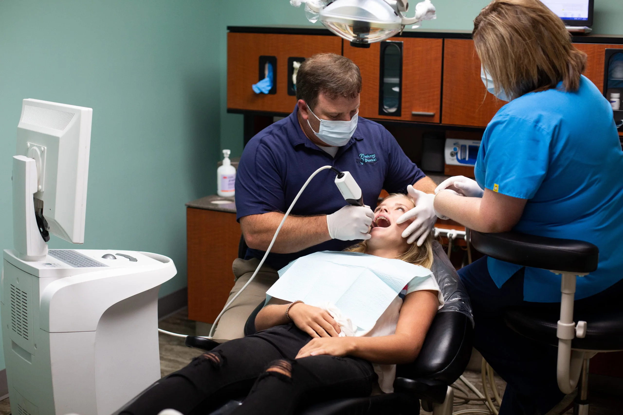 Dental team member providing oral health education